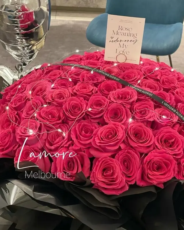 Fifty-two Floyd roses wrapped in black
