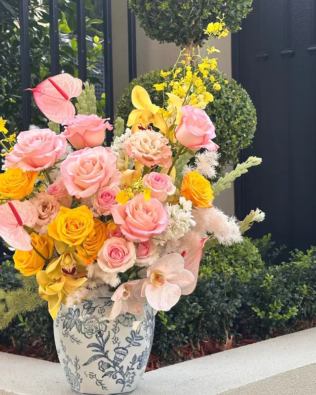 Sunburst Vase Arrangement in a blue-and-white ginger jar